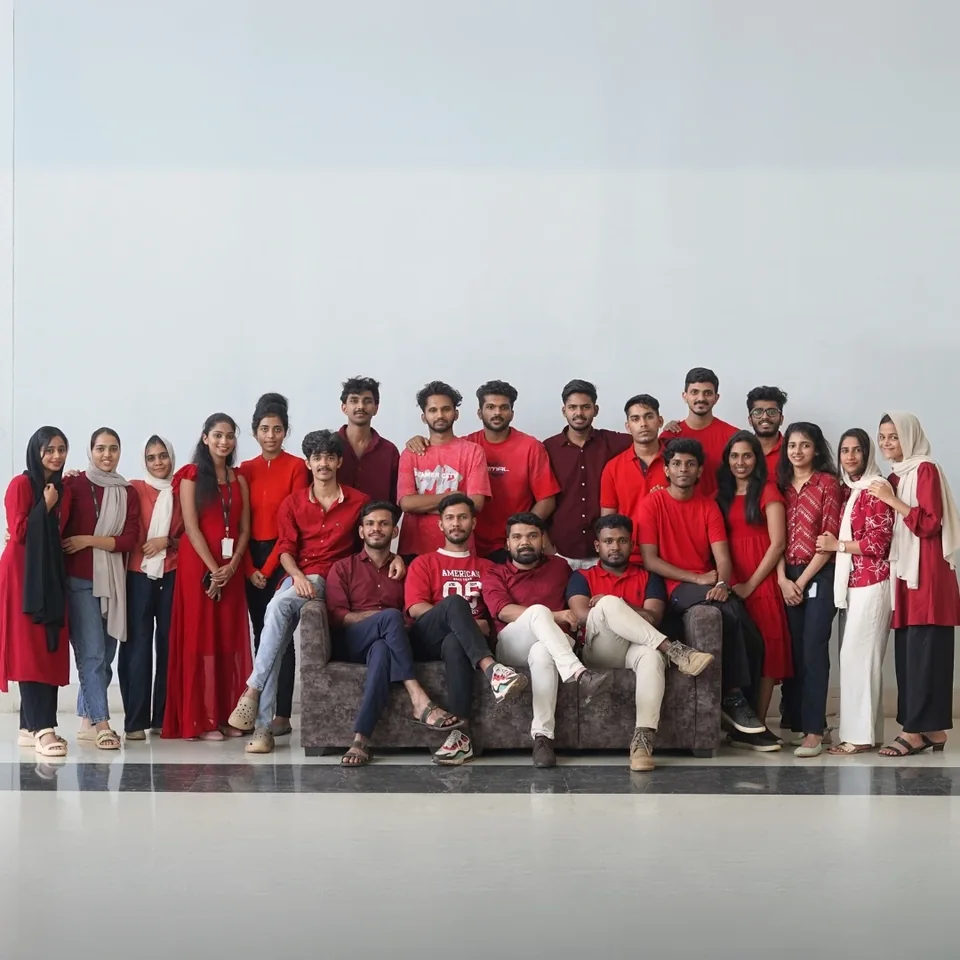 Trogon teammates in red outfits during a Christmas celebration